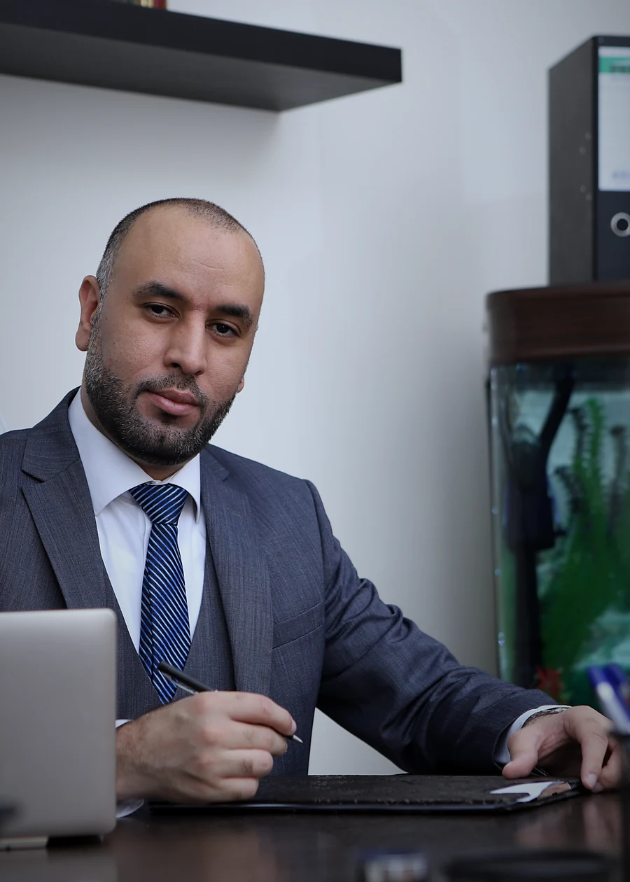 The founder of AL TAMAYUZ at his desk